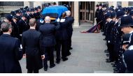 Pall bearers carry the coffin of PC Keith Palmer, the officer killed in the March 22 Westminster terror attack, in to Southwark Cathedral in London on April 10, 2017, for his funeral.  AFP / POOL / Frank Augstein