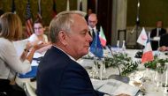 French Foreign Minister Jean-Marc Ayrault sits at a table on the second day of a meeting of Foreign Affairs Ministers from the Group of Seven (G7) industrialised countries on April 11, 2017 in Lucca, Tuscany. / AFP / Vincenzo 