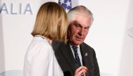 U.S. Secretary of State Rex Tillerson talks with E.U. High Representative for Foreign Affairs Federica Mogherini as they arrive to pose for a family photo during a G7 for foreign ministers in Lucca, Italy April 11, 2017. REUTERS/Max Rossi
