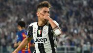 Juventus' forward from Argentina Paulo Dybala celebrates after scoring during the UEFA Champions League quarter final first leg football match Juventus vs Barcelona, on April 11, 2017 at the Juventus stadium in Turin. / AFP / GIUSEPPE CACACE
