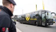 A team bus of German first division Bundesliga football club Borussia Dortmund arrives at the club's training grounds in Brackel near Dortmund, western Germany, on April 12, 2017, one day after an attack on Borussia Dortmund's team bus.  AFP /  Marius Bec