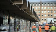 This file photo taken on October 18 2016 shows workers walking through the construction site of the world-biggest start-up incubator Station F, formerly known as the Halle Freyssinet in Paris (AFP / Lionel Bonav) 