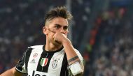 (FILES) This file photo taken on April 11, 2017 shows Juventus' forward from Argentina Paulo Dybala celebrating after scoring during the UEFA Champions League quarter final first leg football match Juventus vs Barcelona, on April 11, 2017 at the Juventus 