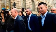 Chinese Han Li (R) and Italian Marco Fassone (L), representatives of Chinese consortium Sino-Europe Sports (SES) arrive to finalize the deal with Fininvest, the Silvio Berlusconi holding, for the AC Milan's takeover on April 13, 2017 in Milan.  AFP / MIGU