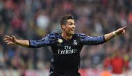Real Madrid's Portuguese forward Cristiano Ronaldo celebrates after scoring during the UEFA Champions League 1st leg quarter-final football match FC Bayern Munich v Real Madrid in Munich, southen Germany on April 12, 2017.   AFP / Christof STACHE