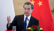 China's Foreign Minister Wang Yi speaks to journalists with his French counterpart Jean-Marc Ayrault during a press conference after their meeting in Beijing on April 14, 2017. China's foreign minister Wang Yi said during a press conference on April 14 th