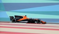 McLaren's Spanish driver Fernando Alonso drives during a practice session ahead of the Formula One Bahrain Grand Prix at the Sakhir circuit in the desert south of the Bahrain's capital, Manama on April 14, 2017. / AFP / KARIM SAHIB
