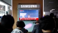 People watch a TV broadcasting a news report on North Korea's failed missile launch from its east coast, at a railway station in Seoul, South Korea, April 16, 2017. REUTERS/Kim Hong-Ji
