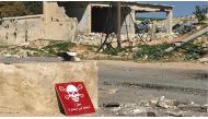 A poison hazard danger sign is seen in the town of Khan Shaykun, Idlib province, Syria on April 5, 2017. On Tuesday more than 100 civilians had been killed and 500 others, mostly children, injured in Assad Regime's suspected chlorine gas attack carried ou