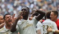 AC Milan's defender from Colombia Cristian Zapata celebrates with teammates after scoring a goal during the Italian Serie A football match Inter Milan vs AC Milan at 
