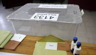 The urn is pictures as ballots with the words in Turkish that read, 'Evet' or 'Yes' and 'Hayir' or 'No', and stamps are prepared for people arriving at a polling station to vote in the referendum on expanding the powers of the Turkish president on April 1
