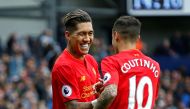 Liverpool's Roberto Firmino celebrates scoring their first goal with Philippe Coutinho. Reuters / Andrew Yates 
