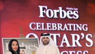 Khuloud Al Omianm (left), CEO of Forbes Middle East ,presenting a memento to Abdulaziz bin Nasser Al Khalifa, CEO of Qatar Development Bank (QDB), during the 'Qatar's Success 2017'  at ST Regis Hotel yesterday. Pic: Baher Amin/The Peninsula
