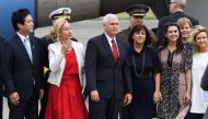 US Vice President Mike Pence (C), his wife Karen (centre R) and two daughters Audrey (2nd R) and Charlotte (R) pose for photographs after arriving at the US naval air facility in Atsugi, Kanagawa prefecture on April 18, 2017. AFP / Toshifumi Kitamura