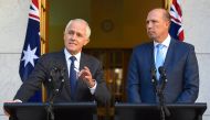 Australia's Prime Minister Malcolm Turnbull speaks as Immigration Minister Peter Dutton listens on during a media conference at Parliament House in Canberra, Australia, April 18, 2017. AAP/Lukas Coch/via Reuters