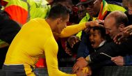Arsenal's Alexis Sanchez gives his shirt to a young fan after the game. via Reuters / Lee Smith Livepic 