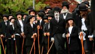 Some 662 people dressed as 'The Tramp' pose for a group picture to mark the first anniversary of Chaplin's World By Grevin, and Charlie Chaplin's birthday, as the museum plans to set the record for the world's largest gathering of people dressed as The Tr