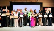 Dana Shell Smith, US Ambassador to Qatar, and Akel I Kahera, Dean of VCUQatar, with the winners of Third Annual Young Writers Competition yesterday. Pic: Abdul Basit / The Peninsula