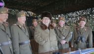 North Korean Kim Jong Un with military officers as he observes a drill photo by Korean Central News Agency KCNA on March 25, 2016 (REUTERS) 
