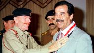 Ezzat al-Douri, an aide of former Iraqi President Saddam Hussein, is seen with Saddam in this undated file photo (REUTERS) 