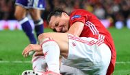 Manchester United's Swedish striker Zlatan Ibrahimovic reacts after falling awkwardly during the UEFA Europa League quarter-final second leg football match between Manchester United and Anderlecht at Old Trafford in Manchester, north west England, on Apri