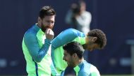 Barcelona's Lionel Messi, Neymar and Luis Suarez take part in a training session. REUTERS/Albert Gea

