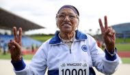 101-year-old Man Kaur from India celebrates after competing in the 100m sprint in the 100+ age category at the World Masters Games at Trusts Arena in Auckland on April 24, 2017. AFP / MICHAEL BRADLEY
