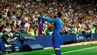 Barcelona's Argentinian forward Lionel Messi celebrates after scoring during the Spanish league Clasico football match Real Madrid CF vs FC Barcelona at the Santiago Bernabeu stadium in Madrid on April 23, 2017. / AFP / OSCAR DEL POZO
