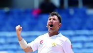 Pakistan bowler Yasir Shah celebrates dismissing West Indies' Alzarri Joseph on the final day of the first Test at the Sabina Park in Kingston, Jamaica