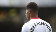 Manchester United's English striker Marcus Rashford warms up with a top spelling the name of Manchester United's Swedish striker Zlatan Ibrahimovic who was injured before the English Premier League football match between Burnley and Manchester United at T
