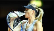 Russian tennis player Maria Sharapova has a drink during a training session at the WTA Tennis Grand Prix in Stuttgart, southern Germany, on April 26, 2017.  AFP / dpa / Bernd Weissbrod
