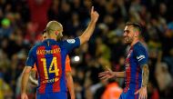 Barcelona's Argentinian defender Javier Mascherano (L) celebrates with Barcelona's forward Paco Alcacer (R) after scoring his first goal with FC Barcelona during the Spanish league football match FC Barcelona vs CA Osasuna at the Camp Nou stadium in Barce