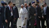 Pope Francis disembarks from his plane upon his arrival at Cairo's International Airport on April 28, 2017, during an official visit to Egypt. AFP / Andreas Solaro