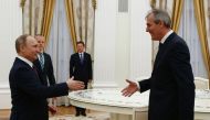 Russia's President Vladimir Putin (L) welcomes Austrian oil and gas group OMV Chief Executive Officer Rainer Seele during a meeting at the Kremlin in Moscow on April 28, 2017. AFP / Sergei Karpukhin