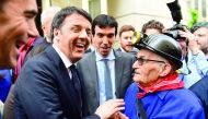 Former Italian prime minister Matteo Renzi (left) meets Mario Zicardi, an old Italian miner residing in Belgium, as Renzi is campaigning for the Italian Democratic Party leadership, in Brussels, yesterday.