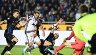 Juventus' Argentinian forward Gonzalo Gerardo Higuain (2ndL) vies with Atalanta players during the Italian Serie A football match Atalanta vs Juventus at the 