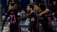 Barcelona's Uruguayan forward Luis Suarez (2ndR) celebrates with Barcelona's Argentinian forward Lionel Messi (C) and teammates after scoring his team's third goal during the Spanish league football match RCD Espanyol vs FC Barcelona at the Cornella-El Pr