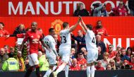 Swansea City's Icelandic midfielder Gylfi Sigurdsson (C) celebrates scoring their first goal to equalise 1-1 during the English Premier League football match between Manchester United and Swansea City at Old Trafford in Manchester, north west England, on 