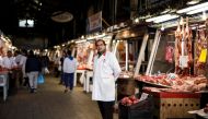 A butcher waits for clients inside the main meat market of Athens, Greece, February 17, 2017 (REUTERS / Alkis Konstantinidis) 