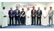 Yousuf Mohamed Al Jaida (centre), CEO, QFC Authority; UPS Madan (fourth right), Metropolitan Commissioner, MMRDA; and P Kumaran (third right), Indian Ambassador to Qatar, with other officials during the MoU signing ceremony at QFC headquarters in Doha. 