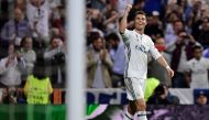 Real Madrid's Portuguese forward Cristiano Ronaldo celebrates his third goal during the UEFA Champions League semifinal first leg football match Real Madrid CF vs Club Atletico de Madrid at the Santiago Bernabeu stadium in Madrid, on May 2, 2017. (AFP / J