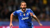 Juventus' forward from Argentina Gonzalo Higuain reacts after scoring a goal during the UEFA Champions League semi-final first leg football match Monaco vs Juventus at the Stade Louis II stadium in Monaco on May 3, 2017. / AFP / FRANCK FIFE
