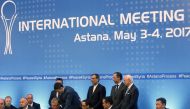 Russian mediator Alexander Lavrentiev, Iranian deputy foreign minister Hossein Jaberi Ansari, Kazakh Foreign Minister Kairat Abdrakhmanov and UN Special Envoy for Syria Staffan de Mistura attend the signing of a memorandum on creating safe zones in Syria 