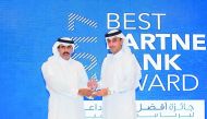 QIIB Deputy CEO Jamal Abdullah Al Jamal, (right) receiving the award from  Qatar Central Bank Governor H E  Sheikh Abdullah bin Saud Al Thani.
