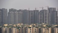 This photograph taken on April 27, 2017, shows incomplete residential apartments in Greater Noida, some 25 kilometres (16 mi) south-east of New Delhi. AFP / CHANDAN KHANNA 