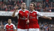 Arsenal's Swiss midfielder Granit Xhaka celebrates with Arsenal's Spanish defender Nacho Monreal (R) after scoring the opening goal of the English Premier League football match between Arsenal and Manchester United at the Emirates Stadium in London on May