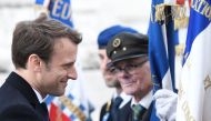 French president-elect Emmanuel Macron salutes the veterans during the ceremony marking the 72nd anniversary of the victory over Nazi Germany during WWII on May 8, 1945 under the Arc de Triomphe monument in Paris on May 8, 2017. / AFP / POOL / STEPHANE DE