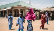 FILE PHOTO: Children walk down the street of Chibok in Borno State, northeast Nigeria on March 25, 2016 (AFP STEFAN HEUNIS) 