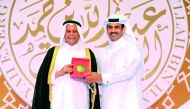 
Abdullah bin Hamad Al Attiyah (left) presenting an award to Saad Al Kaabi, President and CEO of Qatar Petroleum, at 'The 5th Abdullah Bin Hamad Al-Attiyah International Energy Awards 2017' at  Sheraton Grand Doha Resort & Convention Hotel, yesterday.  P