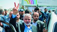 Newly elected Hamas chief Ismail Haniyah flashes the V-sign after attending a rally in support of Palestinian hunger-striking prisoners held in Israeli jails, in Gaza City, yesterday. 